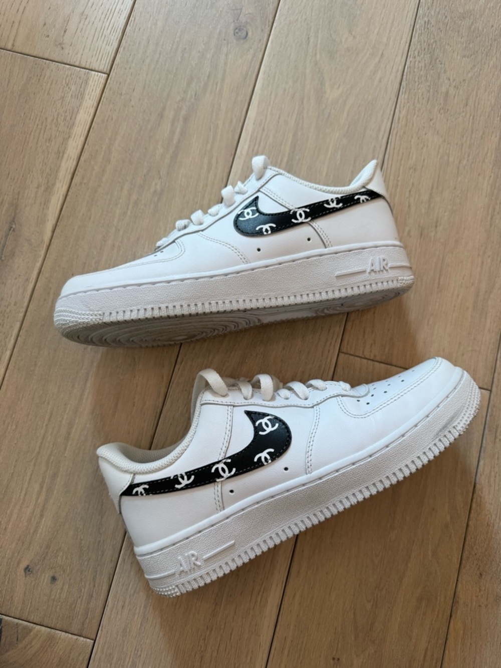 Nike Women’s White Sneakers with Black Logo Accent